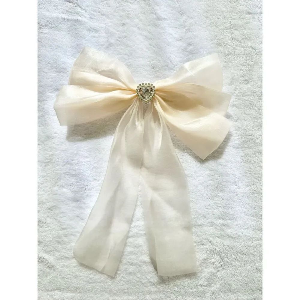 Cream sheer shiny hair bow with rhinestone heart with pearl embellishment